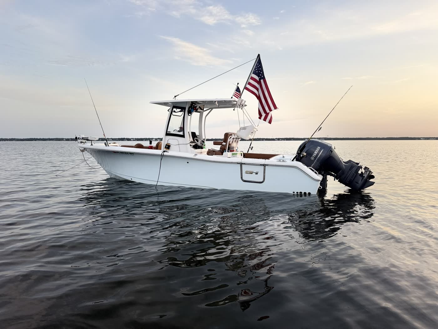 Big Fish Energy charter boat floating peacefully with the American flag flying