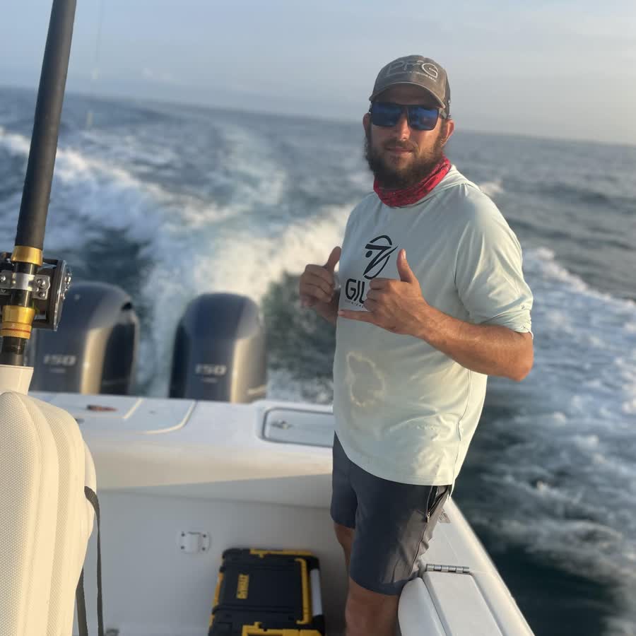 Captain Jon at the helm during an 8 hour pelagic trolling charter